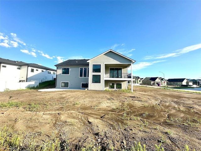 880 Harrington Way, Waukee, IA 50263 - back of property with a balcony and a residential view