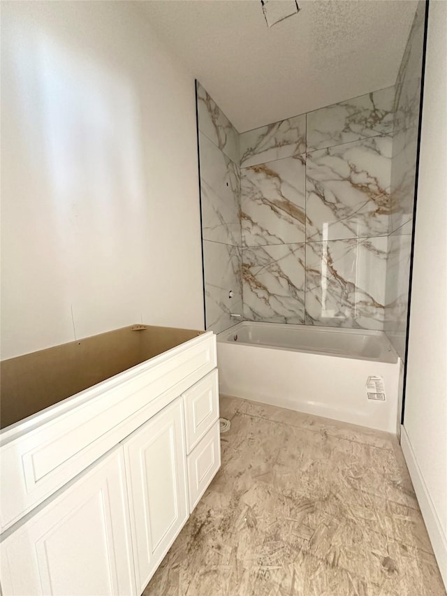 880 Harrington Way, Waukee, IA 50263 - full bathroom featuring shower / tub combination, vanity, and a textured ceiling