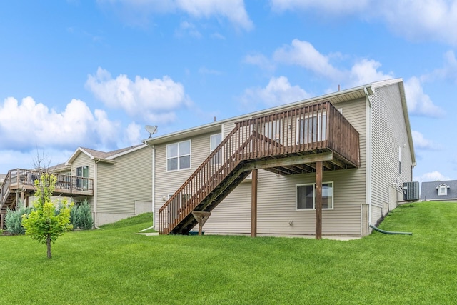 1870 SE Oxford Dr, Waukee, IA 50263 - rear view of property with stairway, a wooden deck, and a lawn