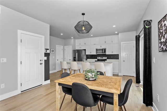 1375 SE Parkview Crossing Dr, Waukee, IA 50263 - dining room with light wood-style flooring and recessed lighting