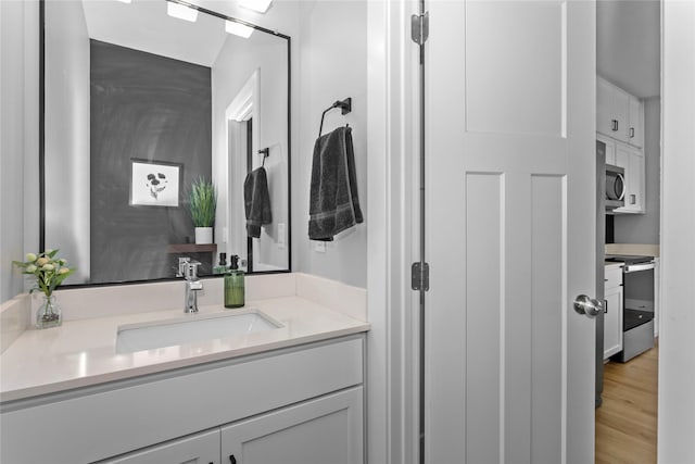 1375 SE Parkview Crossing Dr, Waukee, IA 50263 - bathroom with vanity and wood finished floors