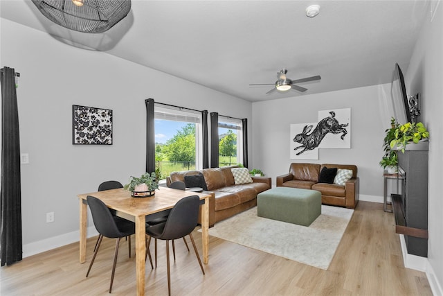 1375 SE Parkview Crossing Dr, Waukee, IA 50263 - dining space with light wood finished floors and a ceiling fan