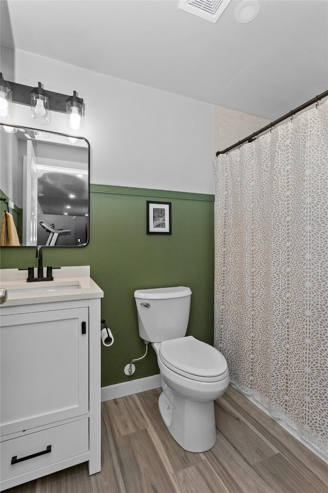 1375 SE Parkview Crossing Dr, Waukee, IA 50263 - bathroom with wood finished floors, vanity, and a shower with curtain