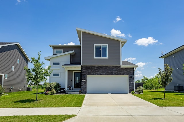 1375 SE Parkview Crossing Dr, Waukee, IA 50263 - view of front of home featuring driveway, a garage, stone siding, and a front lawn