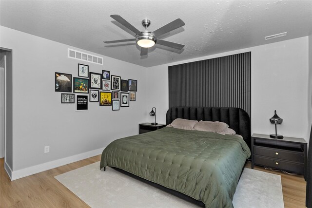 1375 SE Parkview Crossing Dr, Waukee, IA 50263 - bedroom featuring wood finished floors and a ceiling fan