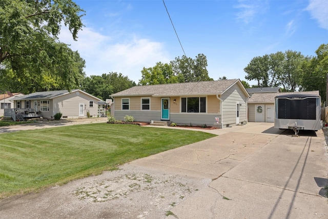 6675 NW 5th St, Des Moines, IA 50313 - ranch-style house featuring concrete driveway, a front yard, and a shingled roof