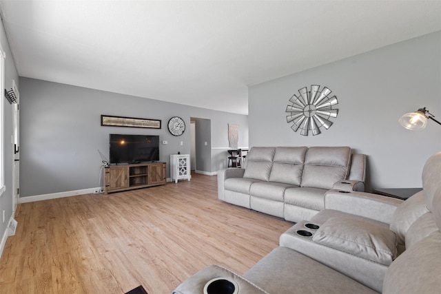 6675 NW 5th St, Des Moines, IA 50313 - living room with light wood finished floors and baseboards