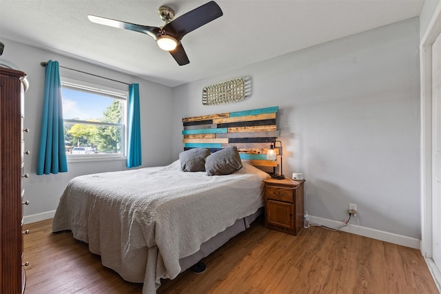 6675 NW 5th St, Des Moines, IA 50313 - bedroom featuring light wood finished floors and ceiling fan