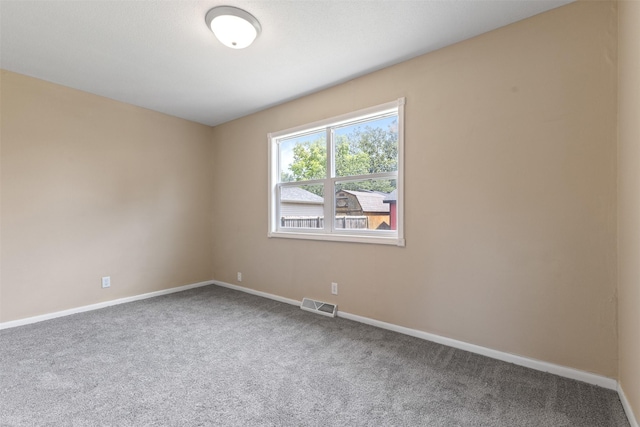 6675 NW 5th St, Des Moines, IA 50313 - carpeted empty room featuring baseboards