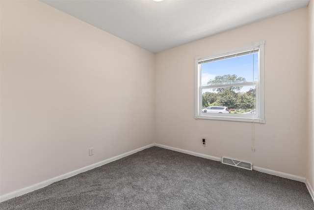 6675 NW 5th St, Des Moines, IA 50313 - unfurnished room with dark colored carpet and baseboards