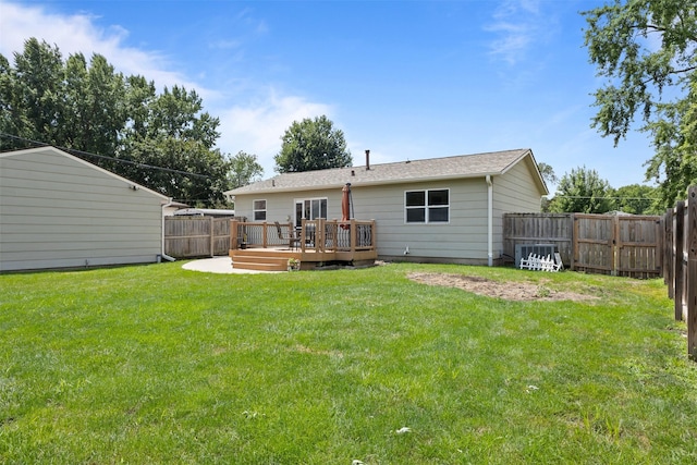 6675 NW 5th St, Des Moines, IA 50313 - back of property featuring a deck and a fenced backyard