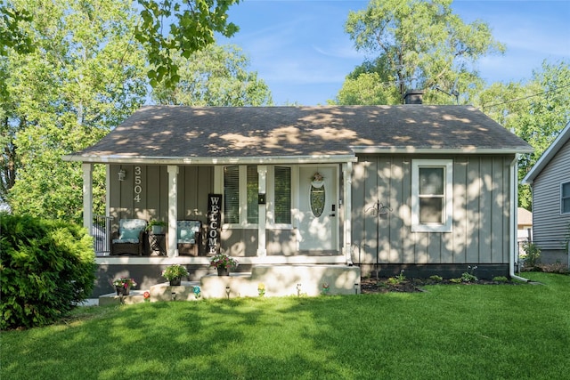 3504 56th St, Des Moines, IA 50310 - view of front of house featuring covered porch, board and batten siding, a front yard, and a chimney