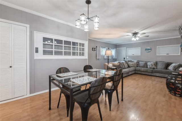 3504 56th St, Des Moines, IA 50310 - dining space with ornamental molding, wood finished floors, ceiling fan, and a textured ceiling