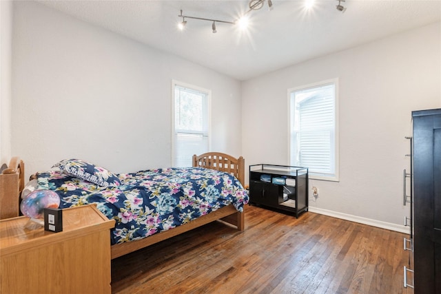 3504 56th St, Des Moines, IA 50310 - bedroom featuring hardwood / wood-style floors and track lighting