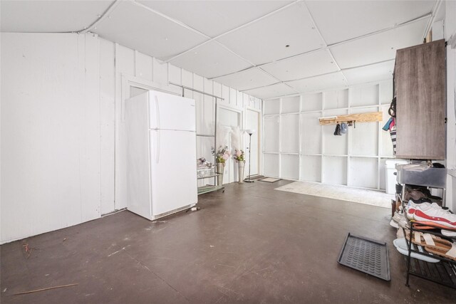 3504 56th St, Des Moines, IA 50310 - garage featuring freestanding refrigerator
