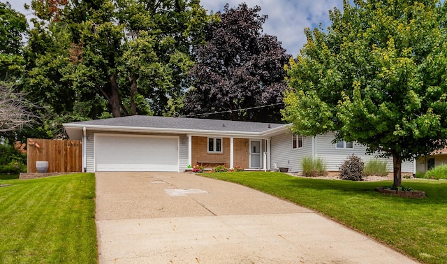 2726 Lakeland Dr, Urbandale, IA 50322 - ranch-style home featuring driveway, an attached garage, brick siding, and a shingled roof