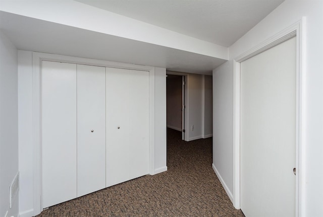 2726 Lakeland Dr, Urbandale, IA 50322 - unfurnished bedroom with dark carpet and a closet