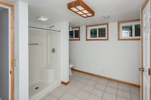 2726 Lakeland Dr, Urbandale, IA 50322 - full bath featuring a stall shower and tile patterned flooring