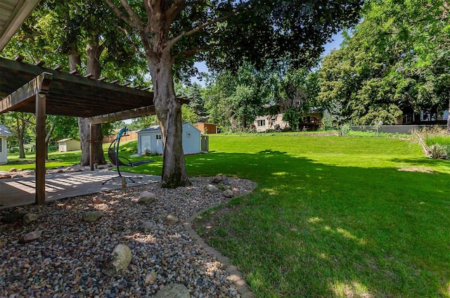 2726 Lakeland Dr, Urbandale, IA 50322 - view of yard with a shed, a pergola, and a patio