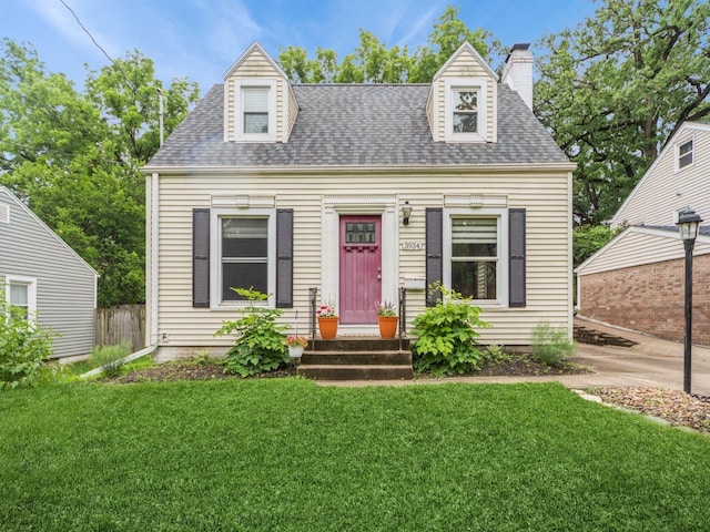 3934 Lincoln Place Dr, Des Moines, IA 50312 - new england style home with a shingled roof and a chimney
