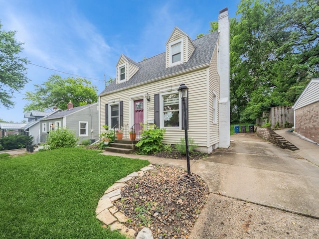 3934 Lincoln Place Dr, Des Moines, IA 50312 - cape cod home with a chimney, roof with shingles, and driveway