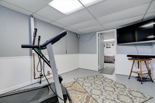 5613 College Ave, Des Moines, IA 50310 - exercise area with a drop ceiling and wainscoting