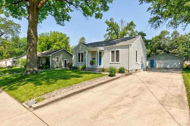 5613 College Ave, Des Moines, IA 50310 - view of front of home with a garage, an outbuilding, and a front lawn
