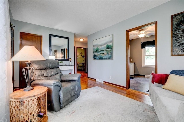 5613 College Ave, Des Moines, IA 50310 - living room with wood finished floors and a ceiling fan