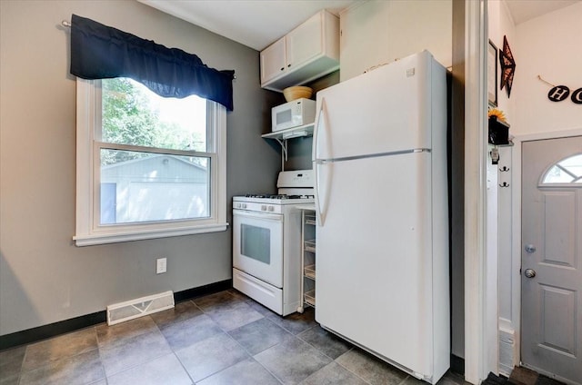5613 College Ave, Des Moines, IA 50310 - kitchen with white appliances and baseboards