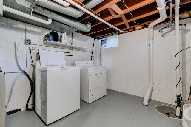 5613 College Ave, Des Moines, IA 50310 - unfinished below grade area featuring separate washer and dryer