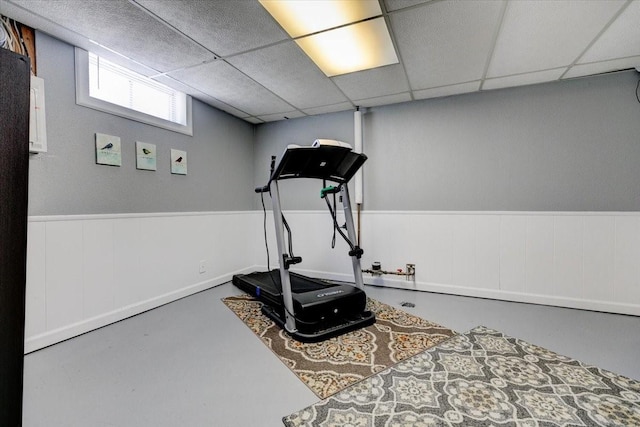5613 College Ave, Des Moines, IA 50310 - workout area with a wainscoted wall and a drop ceiling