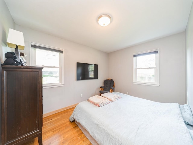 3303 Ashwood Dr, Urbandale, IA 50322 - bedroom with wood finished floors and baseboards