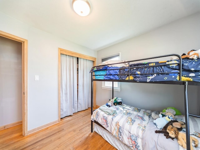 3303 Ashwood Dr, Urbandale, IA 50322 - bedroom featuring wood finished floors and a closet