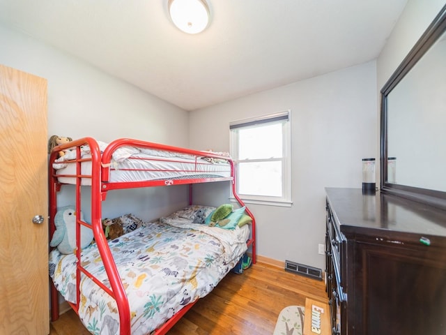 3303 Ashwood Dr, Urbandale, IA 50322 - bedroom featuring wood finished floors and baseboards