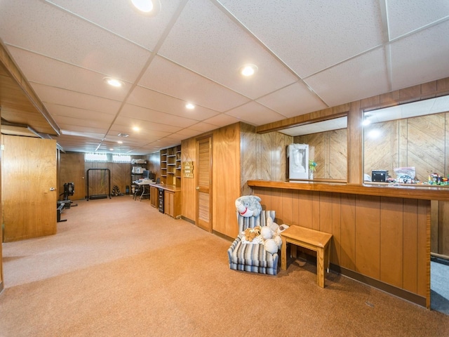 3303 Ashwood Dr, Urbandale, IA 50322 - living area with carpet flooring and wooden walls