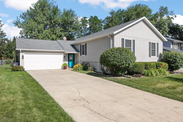 7005 Surrey Dr NE, Cedar Rapids, IA 52402 - view of front of property featuring a shingled roof, a front lawn, concrete driveway, and a garage