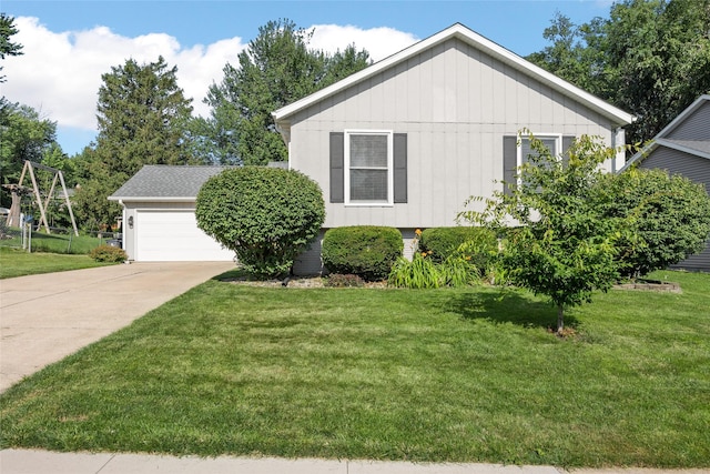 7005 Surrey Dr NE, Cedar Rapids, IA 52402 - view of side of home featuring a lawn, concrete driveway, and an attached garage