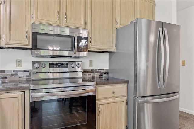 7005 Surrey Dr NE, Cedar Rapids, IA 52402 - kitchen with light brown cabinets, appliances with stainless steel finishes, and decorative backsplash