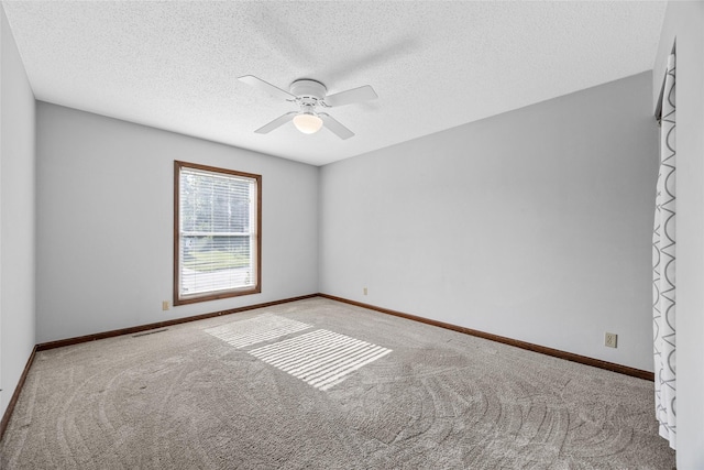 7005 Surrey Dr NE, Cedar Rapids, IA 52402 - unfurnished room with carpet, ceiling fan, and a textured ceiling