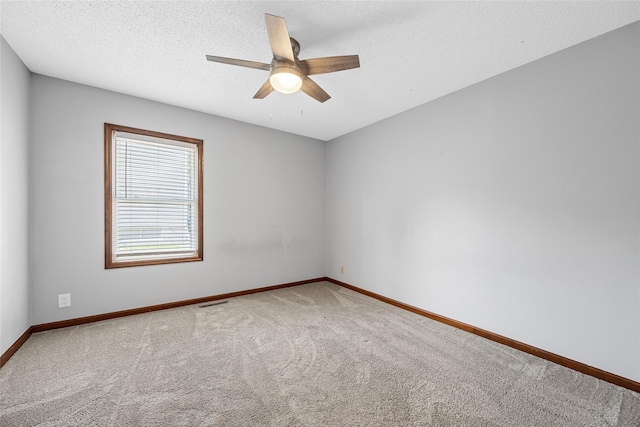 7005 Surrey Dr NE, Cedar Rapids, IA 52402 - carpeted spare room with a ceiling fan and a textured ceiling