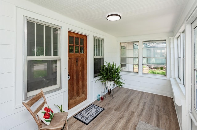910 30th St, Des Moines, IA 50312 - unfurnished sunroom with wood finished floors