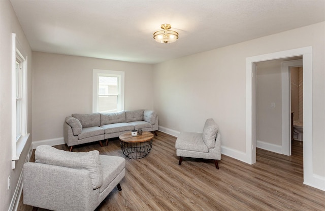 910 30th St, Des Moines, IA 50312 - living area with wood finished floors and baseboards