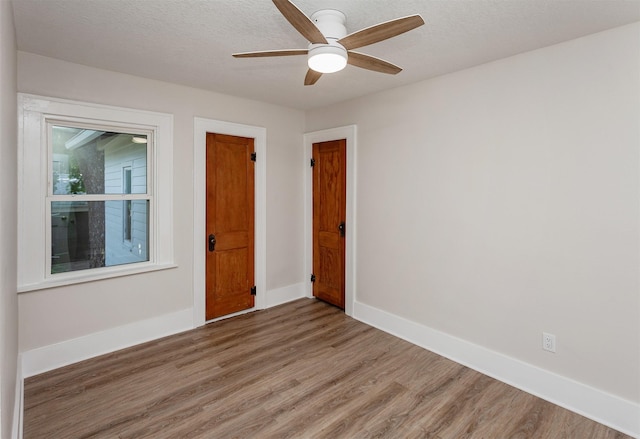 910 30th St, Des Moines, IA 50312 - spare room with light wood-type flooring and ceiling fan