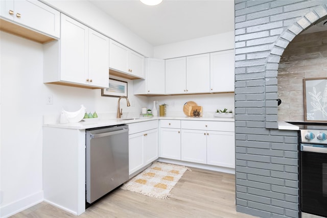 1410 20th St Unit 20, West Des Moines, IA 50265 - kitchen with light wood finished floors, stainless steel appliances, light countertops, and white cabinets