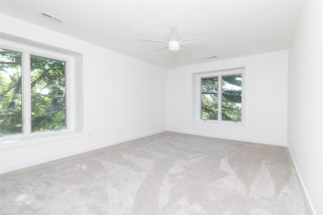1410 20th St Unit 20, West Des Moines, IA 50265 - spare room featuring carpet floors and a ceiling fan