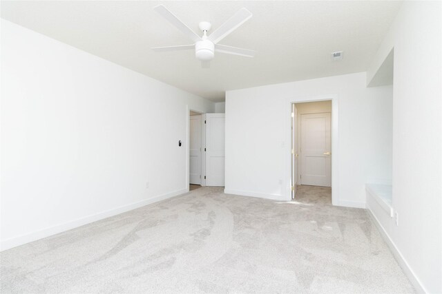 1410 20th St Unit 20, West Des Moines, IA 50265 - unfurnished bedroom featuring light carpet and ceiling fan