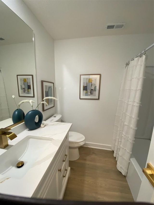 1410 20th St Unit 20, West Des Moines, IA 50265 - full bathroom with wood finished floors, vanity, and shower / bath combo