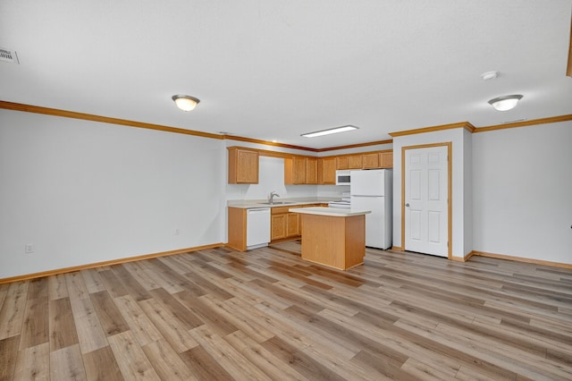 8302 Westown Pkwy Unit 7106, West Des Moines, IA 50266 - kitchen featuring ornamental molding, light countertops, white appliances, light wood-type flooring, and a kitchen island