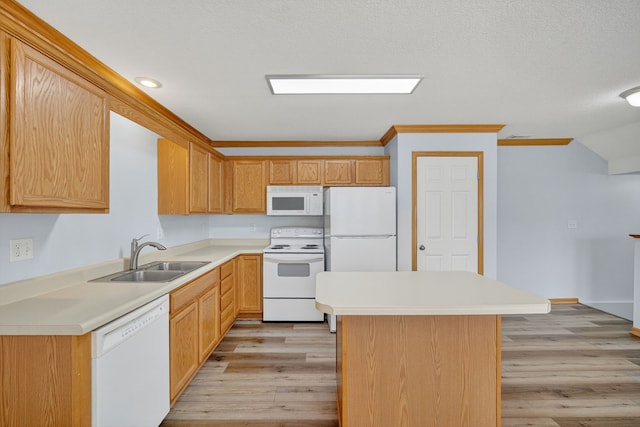 8302 Westown Pkwy Unit 7106, West Des Moines, IA 50266 - kitchen with white appliances, light wood-style floors, light countertops, a center island, and recessed lighting