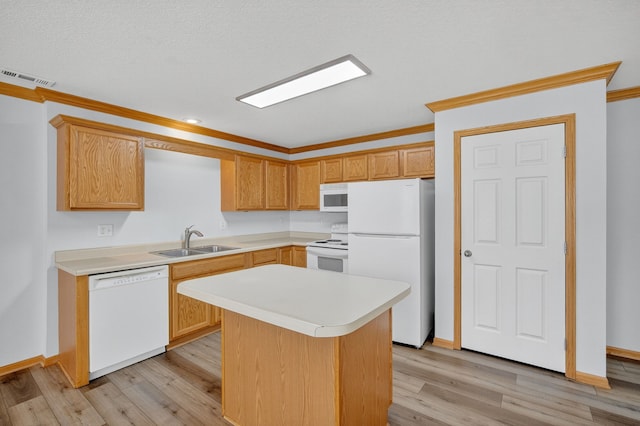 8302 Westown Pkwy Unit 7106, West Des Moines, IA 50266 - kitchen featuring white appliances, light countertops, crown molding, light wood-style flooring, and a kitchen island